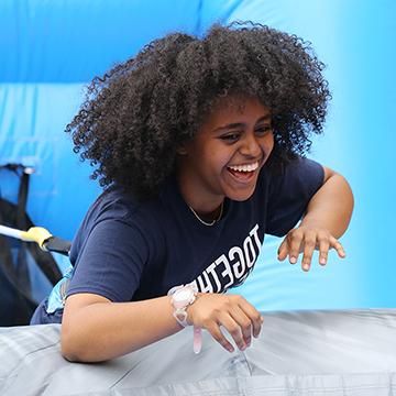 A student enjoys one of the games during the annual end-of-year Campus Craze celebration.